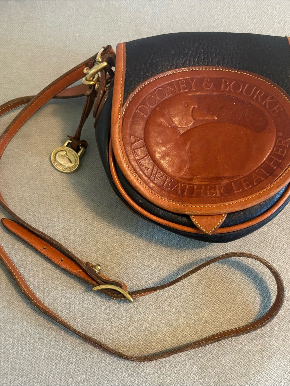Dooney & Bourke Black and Brown Vintage All Weather Leather Duck Crossbody